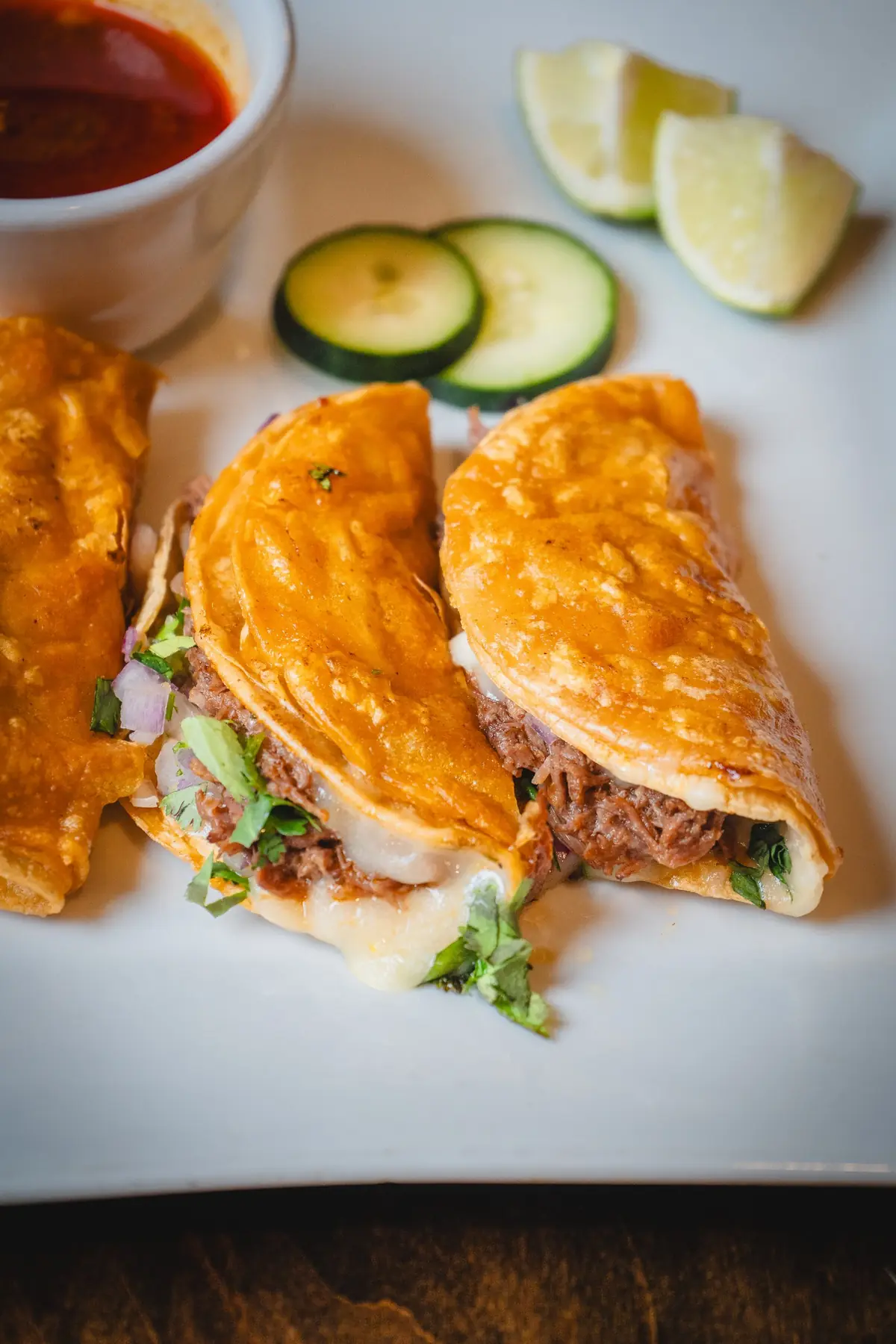 Birria tacos with consommé